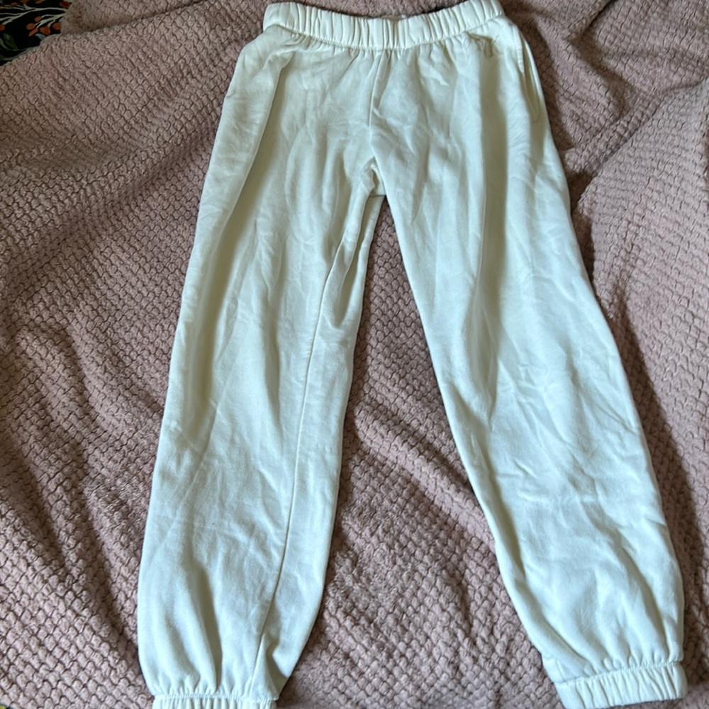 cream sweatpants in a size small from pink